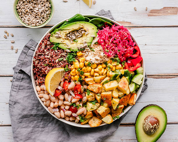 Vegan buddha bowl with roasted potatoes, wild rice and beans