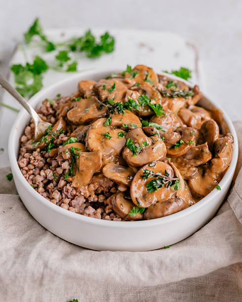 Close-up of a bowl filled with buckwheat and vegan mushroom stew