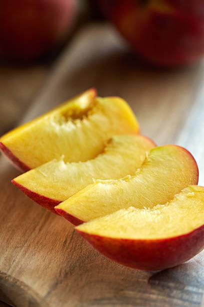 Cutting Peach Fruit on Cutting Board