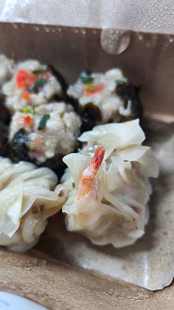istock Chinese steamed dumpling with shrimp in take away food box, selective focus 2220571619