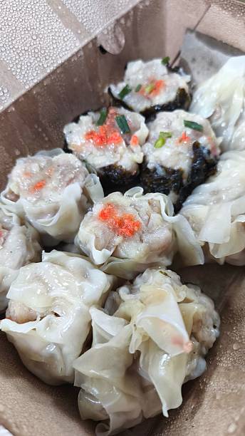 istock Chinese steamed dumpling with shrimp in take away food box, selective focus 2220571620