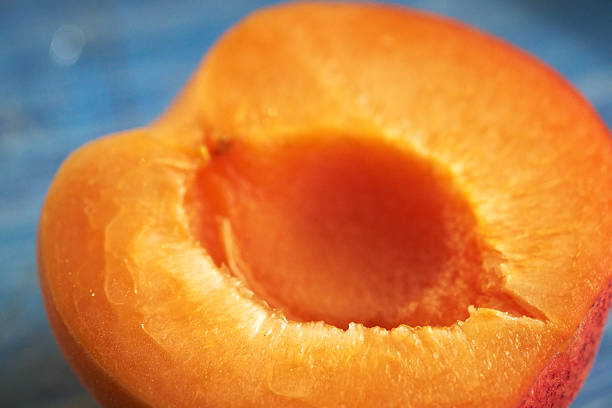 wet orange tomatoes of small size with juicy flesh, yellow tomatoes covered with drops of water