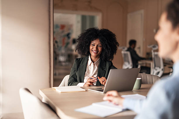 istock Professional Businesswoman Discussing Ideas in a Modern Office Setting 2220572561