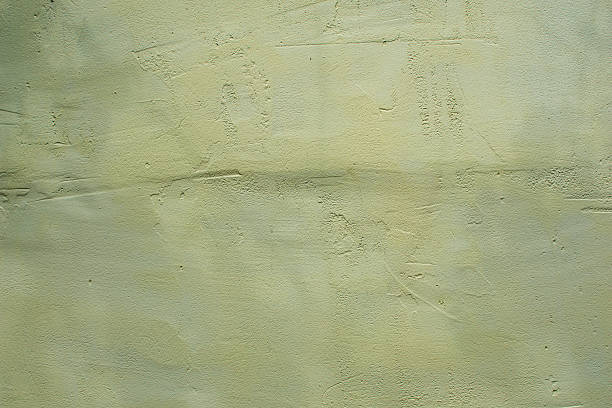 istock The background is a beige wall covered with paint 2220573136
