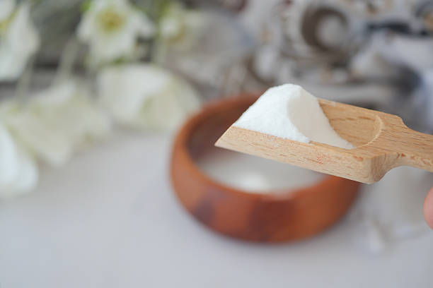 istock pouring Baking soda in a water bowl 2220573514