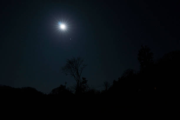 istock Beautiful night, the moon sets 2220574060