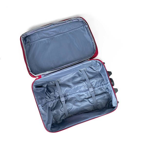istock Open empty suitcase, top view. Red luggage with gray lining, straps, and inner pocket, isolated on white background. Travel or packing concept. File contains a path to isolation. 2220574294