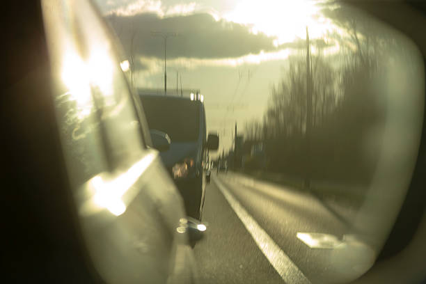 istock The Reflection of Traffic in the Side Mirror During a Beautiful Sunset 2220574520