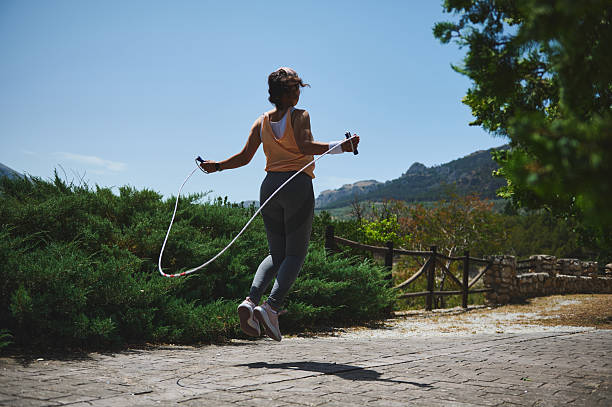 istock Woman Exercising Outdoors with a Jump Rope in a Scenic Mountain Setting 2220575349