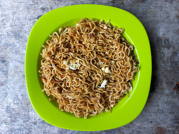 Mi Goreng Telur Or Fried Noodle With Egg And Fried Onion. Food Menu. Top View.