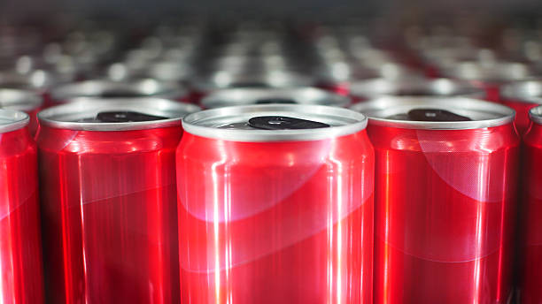 istock Close-up of many red glossy drink cans 2220577584