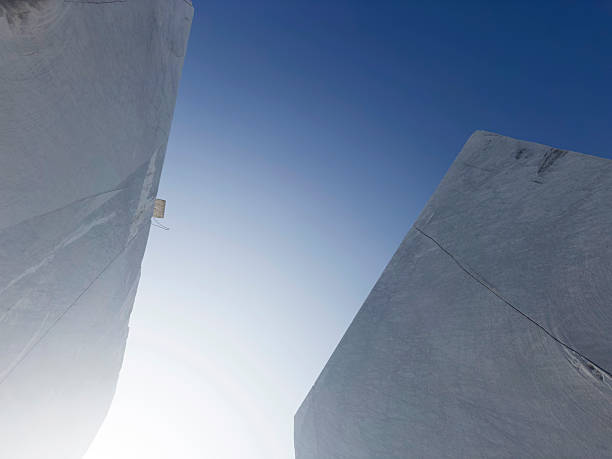 istock Blocks of white marble under the clear sky, vertical and pure geometry 2220577898