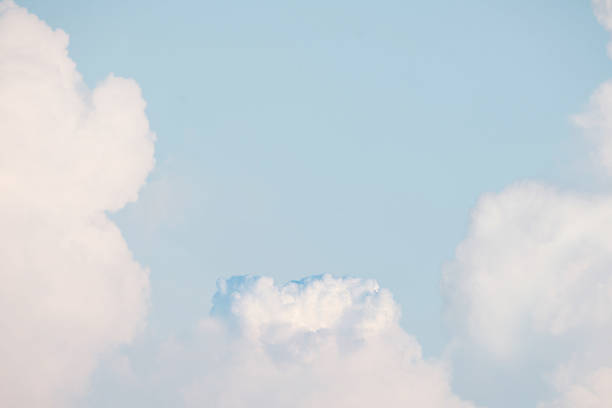 White fluffy cumulus clouds podium on blue sky with empty space background.Beauty cosmetic product placement pedestal present promotion minimal stand display,dreamy concept.