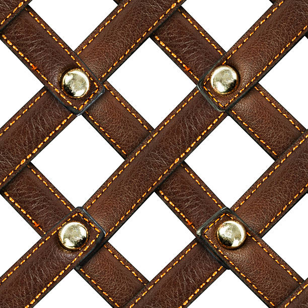 Isolated seamless 4k texture of brown stitched leather strap weave mesh with studs on white background.