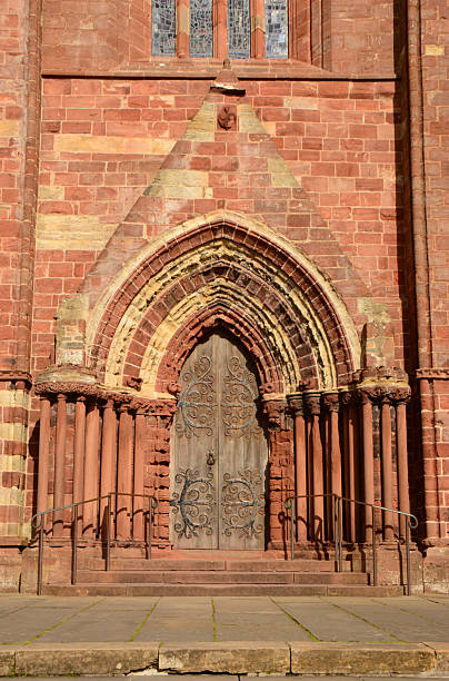 Kirkwall: St Magnus cathedral , close-up  of one  of the side doors. Built with yellow and red sandstone.
