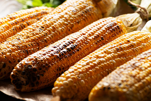 istock Grilled sweetcorn cobs on the table closeup view 2220579953