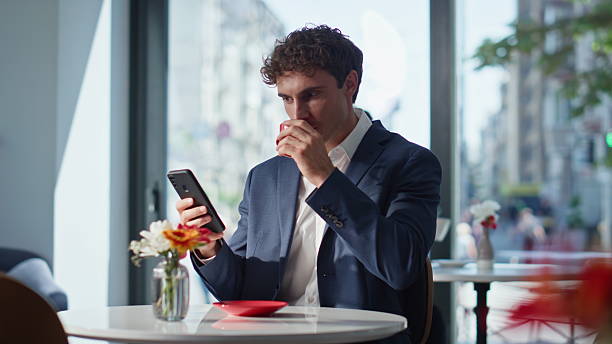 Relaxed ceo enjoying espresso sitting office canteen closeup. Resting colleagues