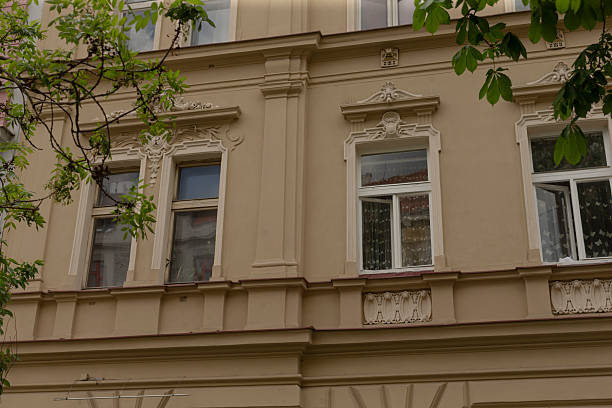 istock Facade of Historic Building with Windows and Decorative Elements 2220582278