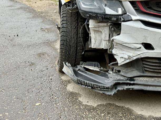 istock Car is severely damaged following a collision and road accident incident recently. This image features a detailed closeup of a car showing extensive frontend damage resulting from a serious accident 2220584302
