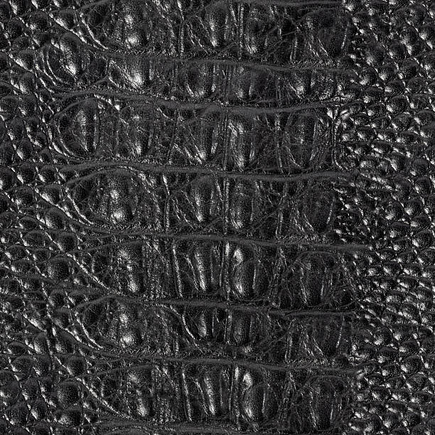 istock Seamless 4k photo texture material of black colored crocodile embossed leather. 2220584337