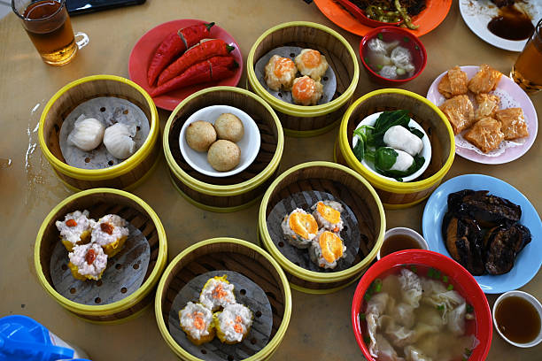 istock Chinese style steamed dim sum dishes in bamboo baskets 2220585468