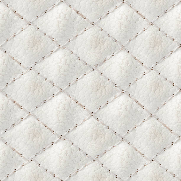 istock Seamless 4k photo texture material of white colored quilted leather surface with stitches. 2220586747