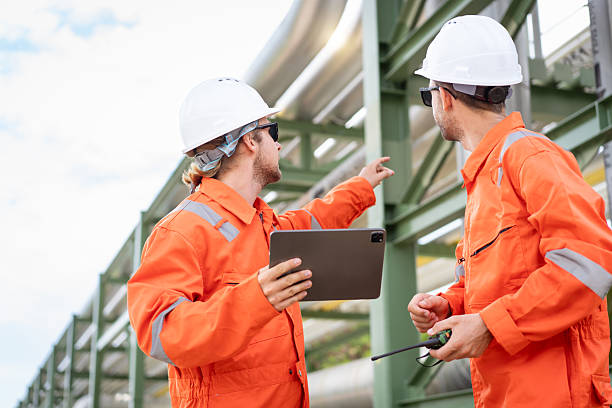 istock Engineers checking on the gas pipes in refinery facility. 2220591713