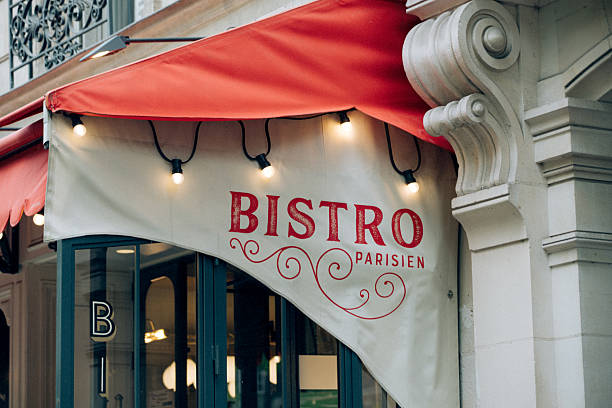 istock Charming Outdoor Parisian Bistro with Decorative Awning 2220591906