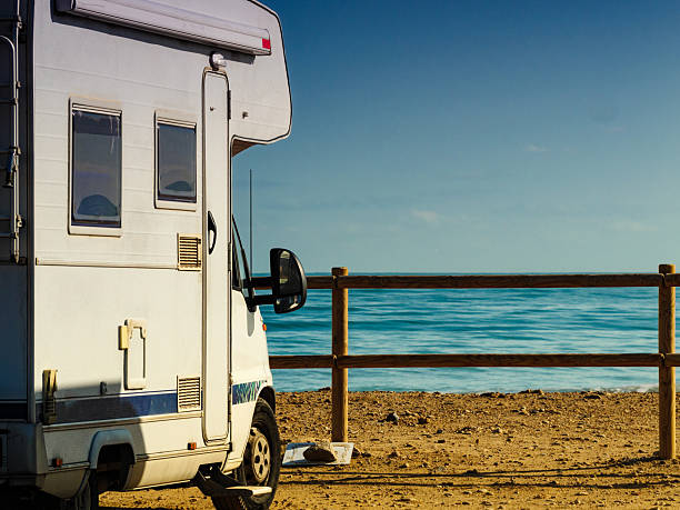 istock Rv motor home camping on beach 2220596250