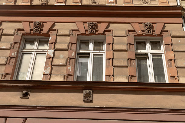 istock Architectural Details of a Building Facade Featuring Ornate Windows 2220597318