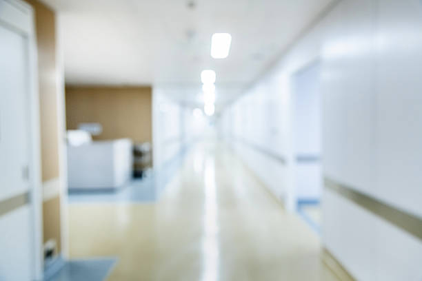 istock Defocused of empty corridor in new modern hospital 2220598667