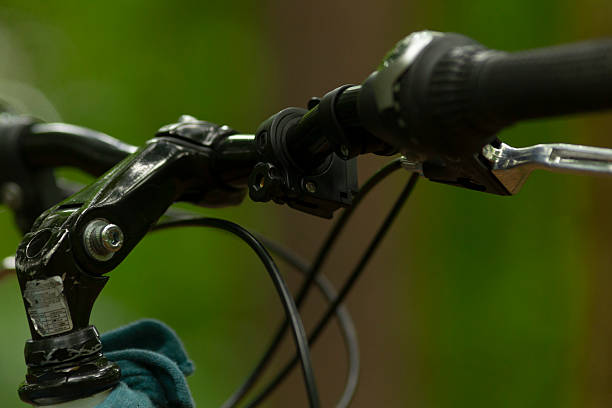 istock A detailed closeup view of bicycle handlebars featuring a gear shifter 2220598713