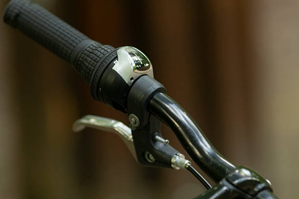 istock Bicycle handlebar equipped with a brake lever and a charming bell attachment 2220598923