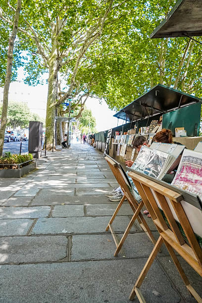 Paris, France. 16 June 2025. A street vendor selling art in Paris, by the Seine river.
