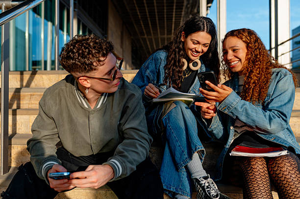 istock University students sharing a moment of levity on campus steps 2220602453