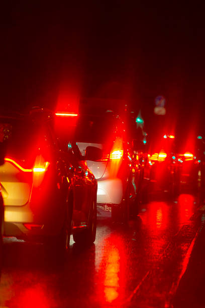 istock A beautiful night scene with vehicle lights reflecting on the pavement 2220602896