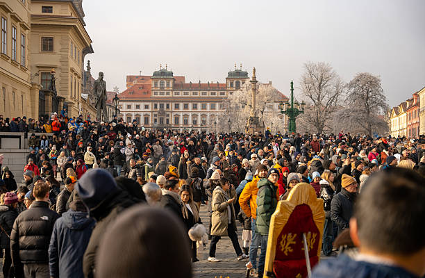 Prague, Czech Republic - December 28, 2024: Tourists observing guard change ceremony in Prague Castle courtyard