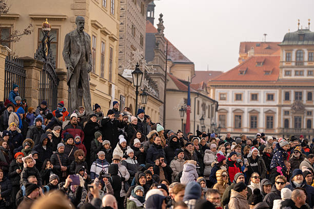 Prague, Czech Republic - December 28, 2024: Tourists observing guard change ceremony in Prague Castle courtyard