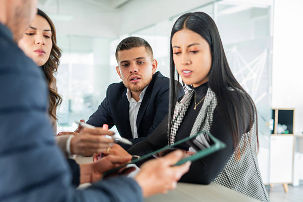 istock Business team discussing ideas with digital tablet 2220603557