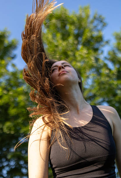 istock Young blonde woman is shaking head in nature. 2220604146