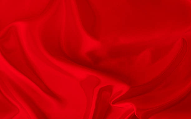 istock Black red satin dark fabric texture luxurious shiny that is abstract silk cloth background with patterns soft waves blur beautiful. 2220605852