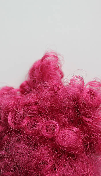 istock Tangled pink synthetic threads of thin diameter closeup view 2220610634