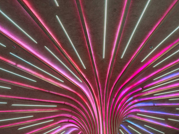 istock Modern ceiling installation with LED light strips. Futuristic interior lighting, Contemporary public space 2220611703