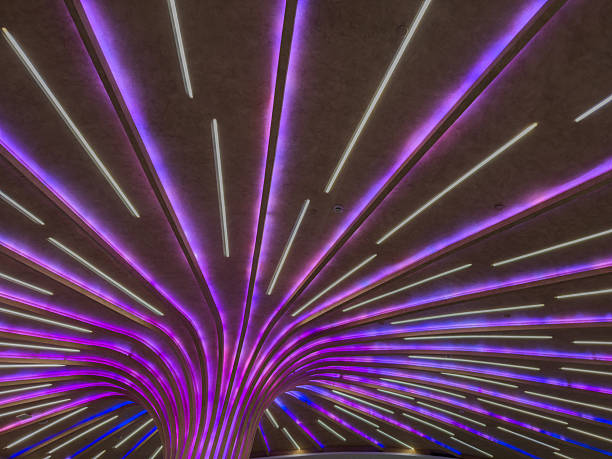 istock Modern ceiling installation with LED light strips. Futuristic interior lighting, Contemporary public space 2220611704