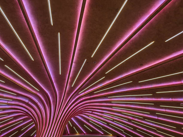 Modern ceiling installation with LED light strips. Futuristic interior lighting, Contemporary public space