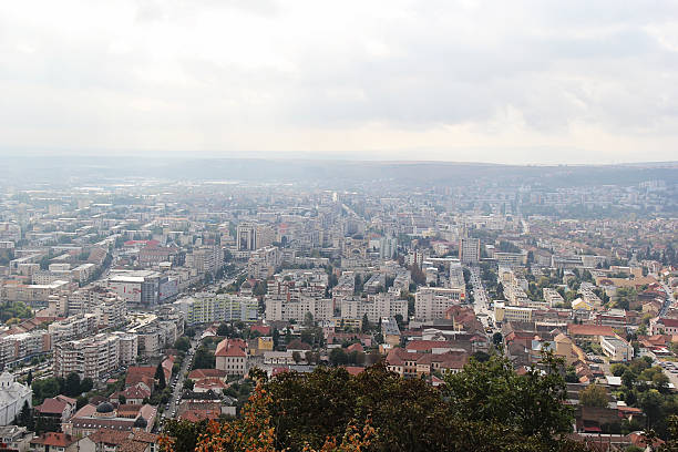 Cluj-Napoca, Romania - December 21, 2023: High view over the city with the Romano-Catholic Church Saint Michael, 1349-1480, in Union Square, in the center of Cluj-Napoca.