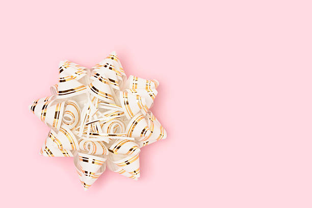 White wrapping paper gift and ribbon with white background.
