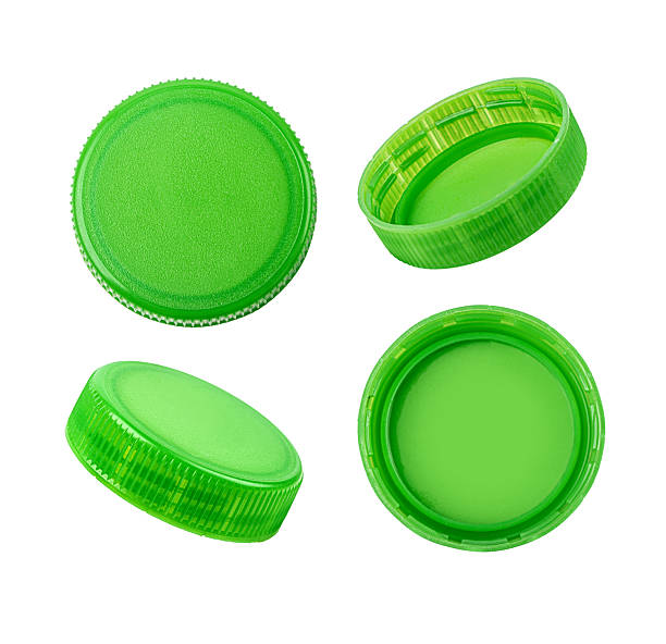 istock Four green plastic bottle caps showing different sides 2220614889