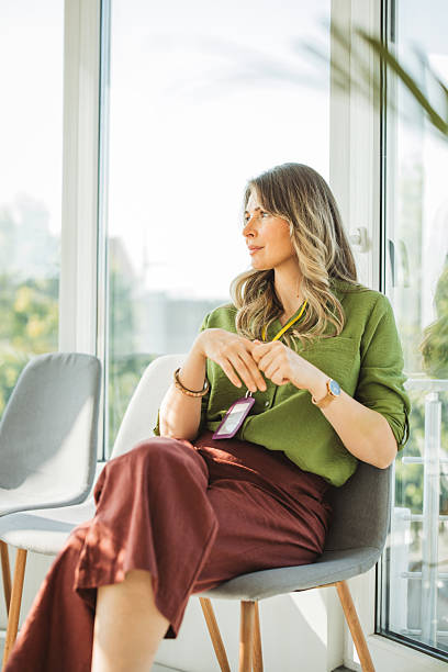 Mature woman smiling at waiting room