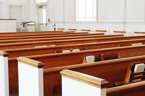 istock close up on seat in church 2220620069